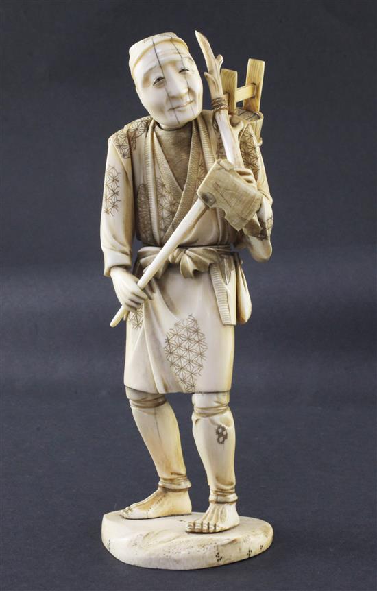 A Japanese sectional ivory figure of a woodsman, early 20th century, 24.5cm